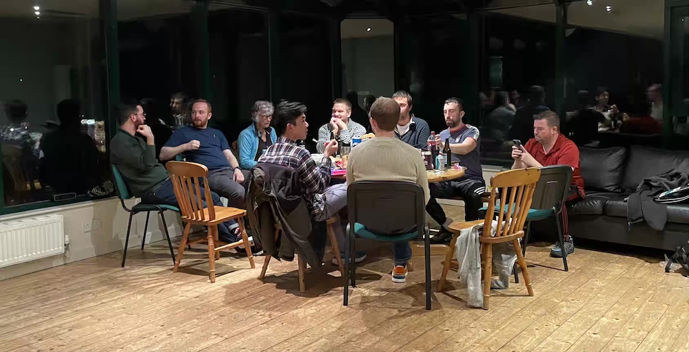 Players socialising in the clubhouse at Dean Tennis and Squash Club